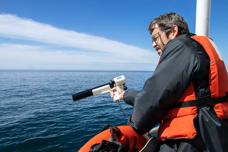 Senior research scientist Barney Balch collects ocean optics data during a research cruise in the Gulf of Maine. Balch is part of a team that has established a new approach to detect algae and measure key ocean properties using light. (Photo courtesy Bigelow Laboratory for Ocean Sciences)