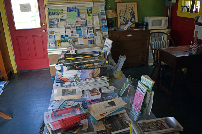 Brochures and other information about the area on a table inside the Damariscotta Region Information Bureau. The building closed in 2018. (Evan Houk photo)