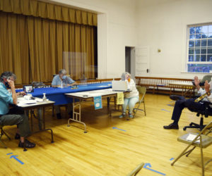 AOS 98 Superintendent Keith Laser (right) discusses changes to Edgecomb's education budget with the board of selectmen. From left: Selectmen Mike Smith, Ted Hugger (on tablet), and Jack Sarmanian; Town Clerk Claudia Coffin; and Laser. (Hailey Bryant photo)