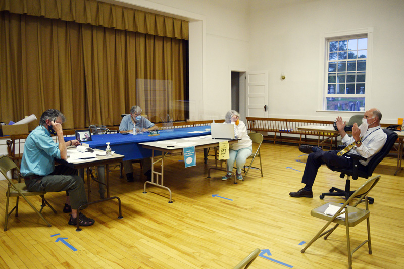 AOS 98 Superintendent Keith Laser (right) discusses changes to Edgecomb's education budget with the board of selectmen. From left: Selectmen Mike Smith, Ted Hugger (on tablet), and Jack Sarmanian; Town Clerk Claudia Coffin; and Laser. (Hailey Bryant photo)