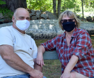 COVID-19 survivors Bob and Carolyn Hatch sit outside their Newcastle home on Saturday, Sept. 5. The Hatches urge everyone to remain vigilant with masking and physical distancing because of the severity of the illness. (Evan Houk photo)
