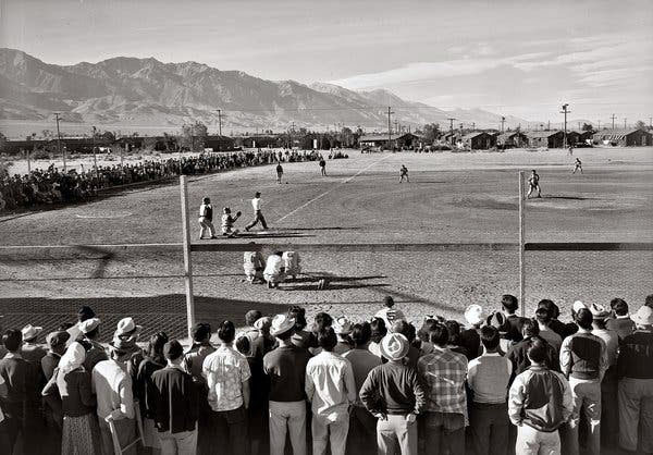 Baseball lifted spirits at Japanese internment camps during World War II, as shown in this photo by Ansel Adams.