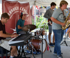 The Wharf Cats perform at Schooner Landing in Damariscotta on Aug. 8. From left: Tom Linkas, Nick Clifford, Ben Clifford, and Sam Hall. (Evan Houk photo)