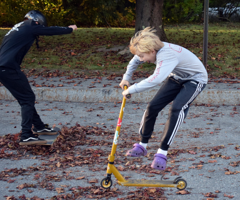 From left: Adrian Oliver and Fletcher Collamore, both 13, do tricks near the corner of Hodgdon and Church streets in Damariscotta on Monday, Oct. 5. The kids are working with parents and police to find a permanent place to skate. (Evan Houk photo)