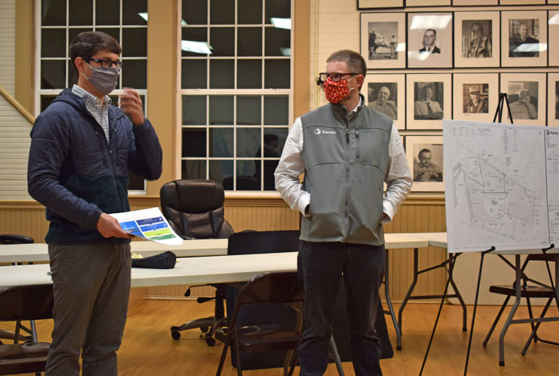 From left: Allen Tate, of EDF Renewables Distributed Solutions Inc., and Eben Baker, of Stantec, present a plan for an approximately 5-megawatt solar array on Christian Hill Road in Bristol during a public hearing at the town hall, Thursday, Nov. 5. (Evan Houk photo)