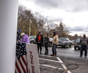 Voters wait in line at the Waldoboro municipal building Tuesday, Nov. 3. Waldoboro had 10 questions on a local ballot, including a much-debated referendum regarding the sale of A.D. Gray School. (Bisi Cameron Yee photo)