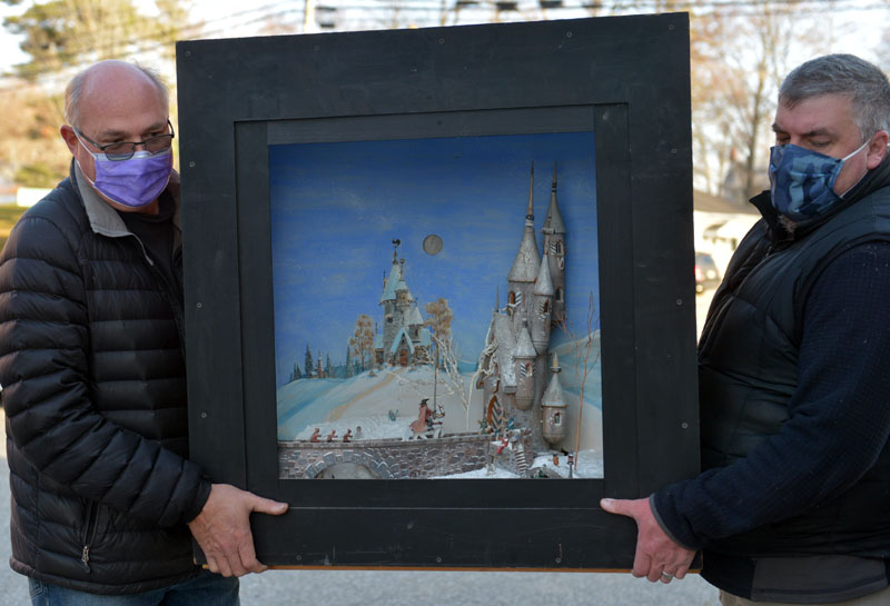 Dirk Poole and Justin Day carry Jake Day's castle diorama. (Paula Roberts photo)