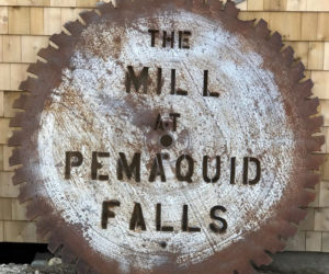 A massive 66-inch-diameter saw-blade sign rests against the Mill at Pemaquid Falls. A movable stand will soon be constructed. (Photo courtesy Mark Ziarnik)