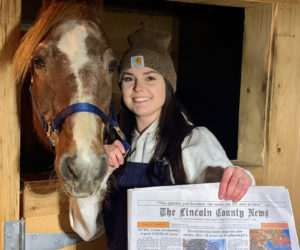 Brooke Alley holds a copy of the Oct. 29 edition of The Lincoln County News with her photo of Camelot on the front. The photo won the October contest before going on to win the annual contest. (Photo courtesy Brooke Alley)