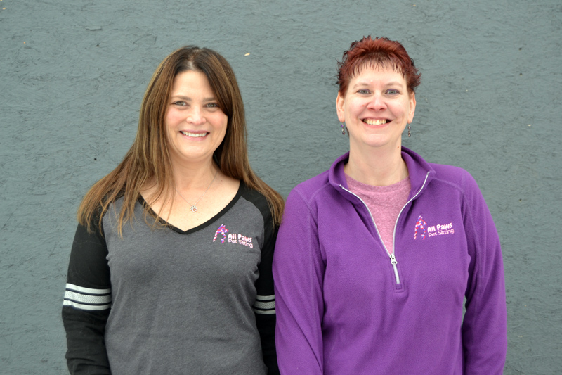 Julie Greenleaf (left) and Sarah Caton care for local animals through Caton's business, All Paws Pet Sitting. All Paws is celebrating five years in business.