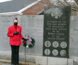 Clara Wentworth, of the Daughters of the American Revolution, lays a wreath at the Wiscasset veterans memorial for Veterans Day.