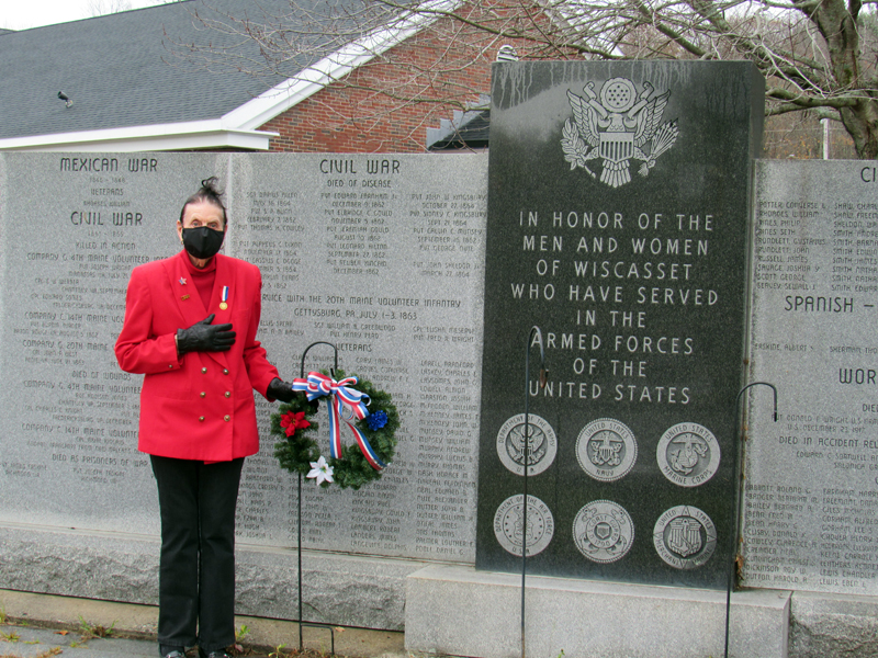 Clara Wentworth, of the Daughters of the American Revolution, lays a wreath at the Wiscasset veterans memorial for Veterans Day.