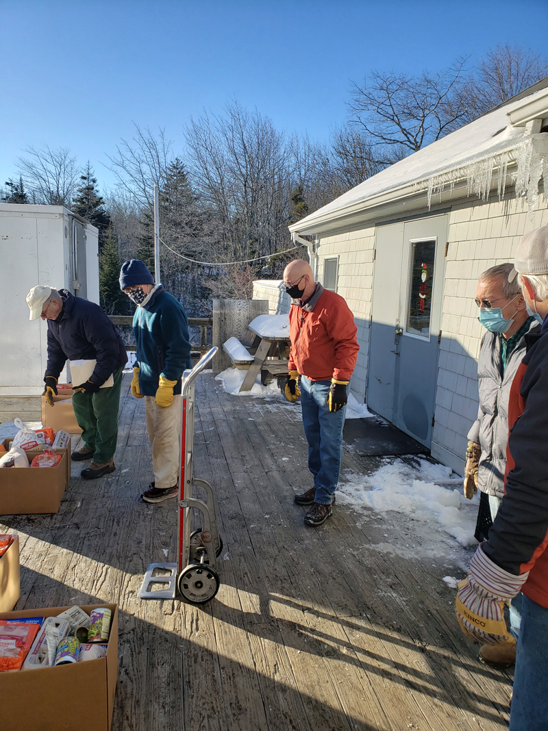 Bristol Area Lions, Michael Hope, Bob Ives, Bill Crider, Chris Leeman, and helper Craig Leeman load six vehicles at ReillyÂ’s in New Harbor. (Photo courtesy Brendan Donegan)