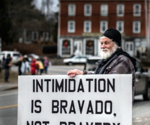 Clayton Herbert, of Damariscotta, joins more than 50 others to mark Martin Luther King Jr. Day with an anti-racism vigil in Newcastle. (Bisi Cameron Yee photo)