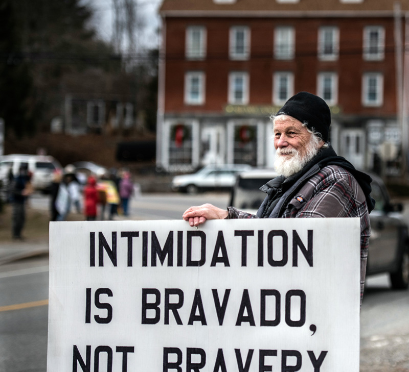 Clayton Herbert, of Damariscotta, joins more than 50 others to mark Martin Luther King Jr. Day with an anti-racism vigil in Newcastle. (Bisi Cameron Yee photo)