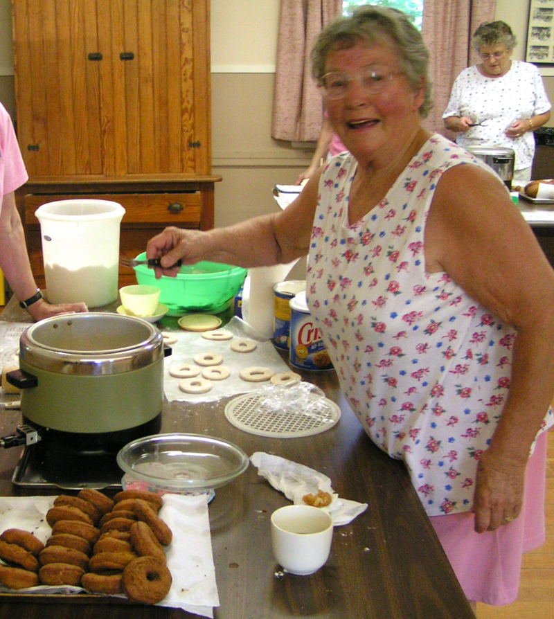 Mary Feyler deep-fries donuts in North Nobleboro in 2005. Feyler will celebrate her 100th birthday on Friday, Jan. 8. (Photo courtesy Hilary Petersen)