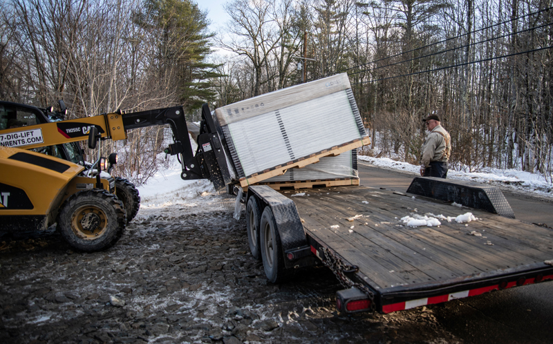 The last batch of solar panels is delivered to the SunRaise solar garden in Waldoboro on Dec. 22. (Bisi Cameron Yee photo)