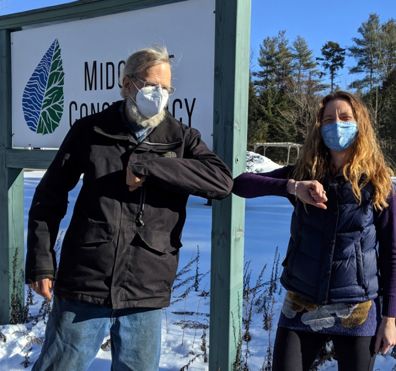 Landowner, Jim Doble, and Land Protection Specialist, Anna Fiedler, formalize Dobles donated Conservation Easement on land in Waldoboro.