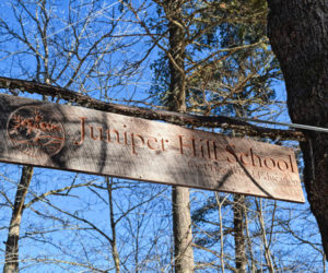 The sign at the entrance to the Juniper Hill School for Place-based Education, at 180 Golden Ridge Road in Alna. (Hailey Bryant photo)