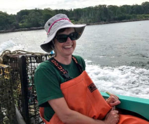 Dr. Kristin Kentopp fishes for lobster off the coast of Bristol. The Togus physician and former professional ballerina holds a recreational lobster license. (Photo courtesy Kristin Kentopp)