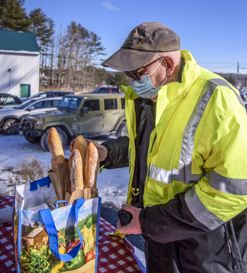 William Nicholson stocks up on baguettes in Jefferson on Friday, Jan. 29. (Bisi Cameron Yee photo)