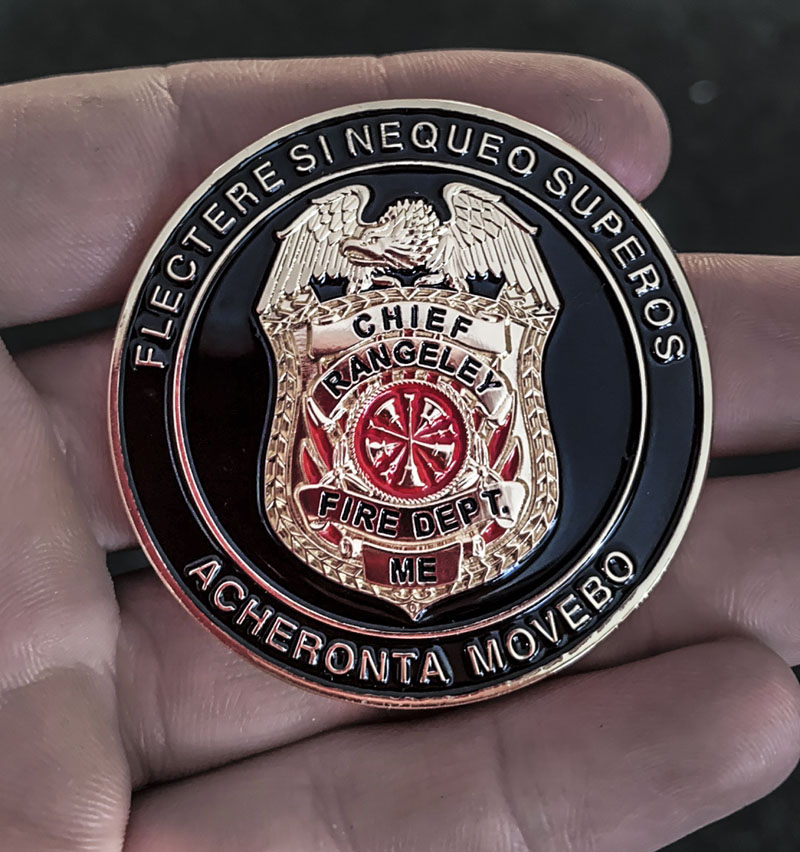 The "Chief's Coin" given to Jefferson volunteer firefighter and first responder Oakley Oliver by Rangeley's fire and rescue chief in recognition of Oliver's assistance to an injured snowmobiler on Feb. 14. (Photo courtesy Jen Oliver)