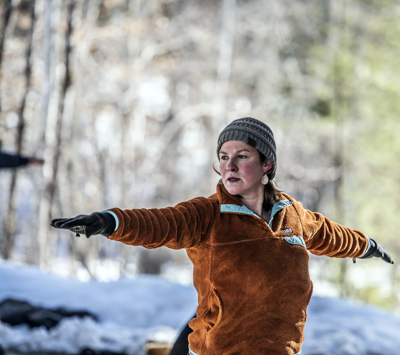 Alicia Hunter strikes a "Warrior 2" pose during a snowshoe yoga session at Hidden Valley Nature Center in Jefferson on Sunday, Feb. 21. Hunter said the class was "perfectly paced." (Bisi Cameron Yee photo)