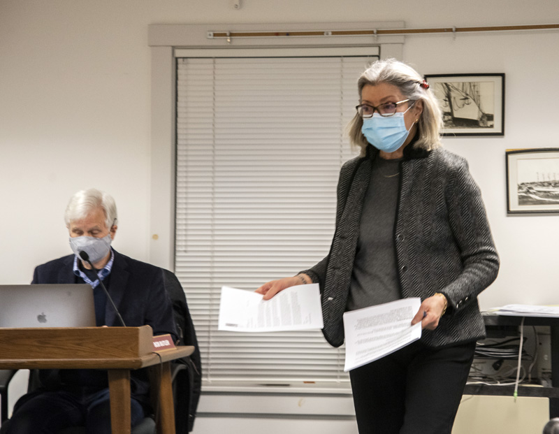 Surran Pyne, representative of the A.D. Gray Park Coalition, passes out information on the coalition's proposal during a selectmen's meeting in Waldoboro on Tuesday, Feb. 23. (Bisi Cameron Yee photo)