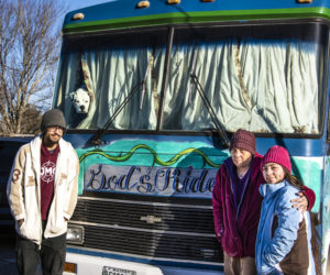 From left: Jacob, Jennifer, and Marijane Guerrero stand in front of their bus in Waldoboro on Jan. 23. The Guerreros plan to continue their traveling ministry after the loss of their husband and father, Joe Guerrero. (Bisi Cameron Yee photo)
