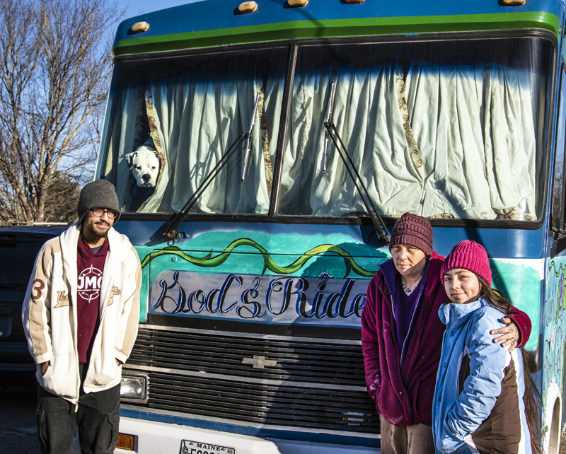 From left: Jacob, Jennifer, and Marijane Guerrero stand in front of their bus in Waldoboro on Jan. 23. The Guerreros plan to continue their traveling ministry after the loss of their husband and father, Joe Guerrero. (Bisi Cameron Yee photo)