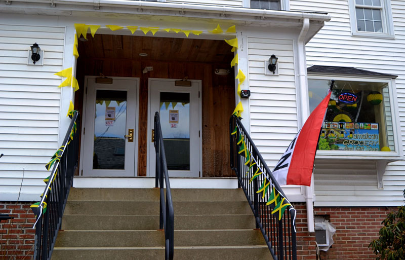 Jamaican flags line the steps up to J & J Jamaican Grocery and Gift Shop at 88 Main St. in Damariscotta. The entrance is on Courtyard Street, between the new and old locations of Best Thai. (Nettie Hoagland photo)