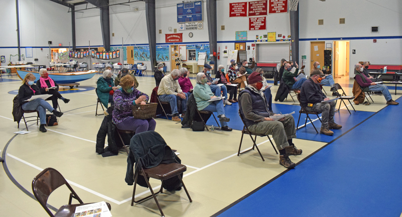 About 35 South Bristol residents attend annual town meeting in the South Bristol School gym on Tuesday, March 9. The meeting was fairly typical, despite the addition of masks and physical distancing. (Evan Houk photo)