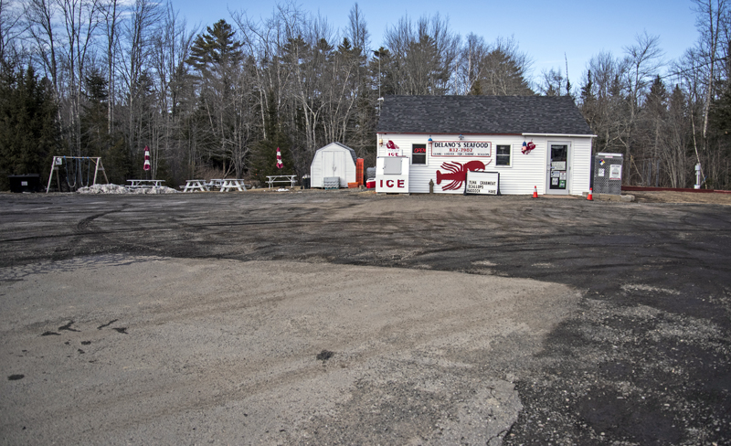 Delano Seafood Market in Waldoboro plans to build an addition onto the left side of the building, toward the picnic tables. The addition will allow the market to expand its retail space, while a new deck at the back of the building will expand seating for the Delano Seafood Shack. (Bisi Cameron Yee photo, LCN file)