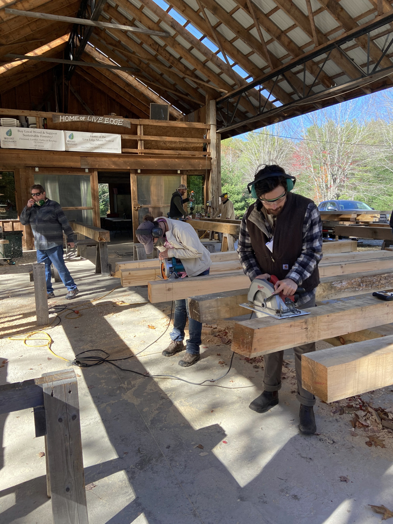 Beams lined up at a timber frame course.