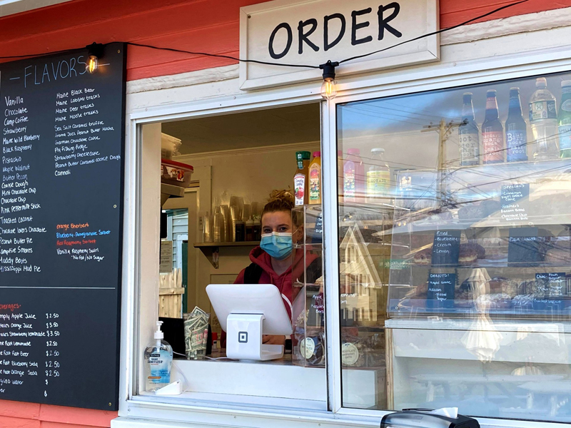 Norma Leeman welcomes customers to Harbor Ice Cream and Cafe on the Hill, Tuesday, April 6. The ice cream stand has expanded into the coffee business. (Nettie Hoagland photo)