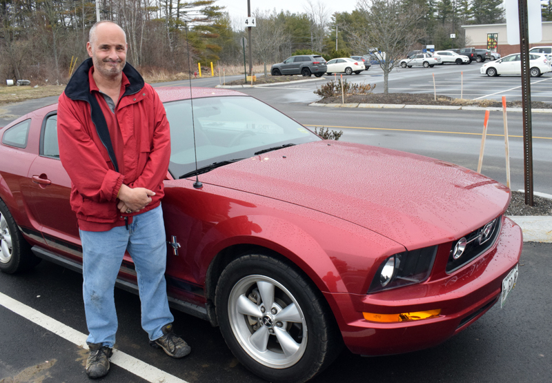 Kyle LeBeau stands beside his beloved "Mustang Sally" at his workplace, Hannaford Supermarket in Damariscotta, March 25. (Evan Houk photo)