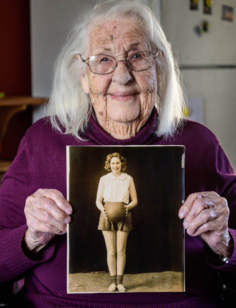Fran Williamson, 103, poses for a picture with her younger self on Saturday, April 10. Williamson was the captain of the girl's basketball team at Crosby High School in Belfast. (Bisi Cameron Yee photo)