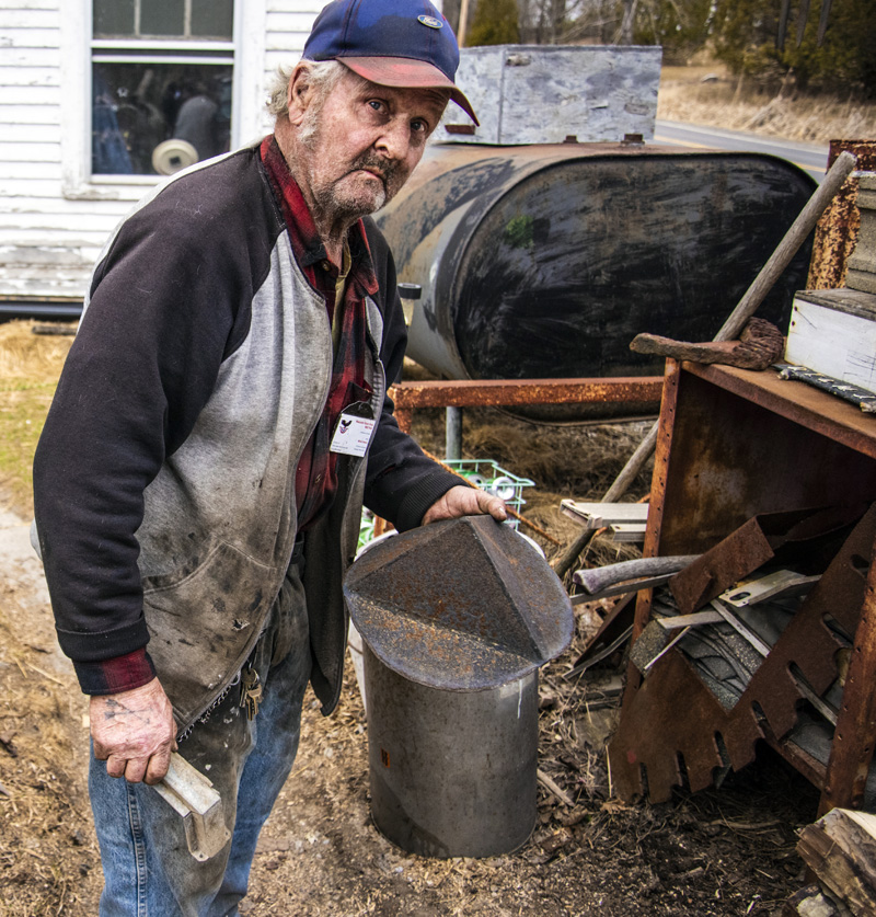 Millard Hassan holds a chimney cap he crafted in Newcastle on Wednesday, March 24. While Hassan's fame comes from the worm and clam hoes he creates, he has taught himself additional useful skills. (Bisi Cameron Yee photo)