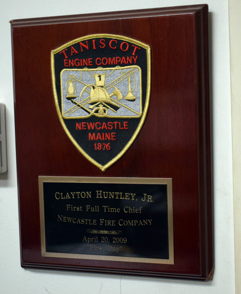 A plague in the fire chief's office at the Clayton V. Huntley Jr. Station in Newcastle commemorates Huntley's installation as the town's first full-time fire chief on April 20, 2009. (Evan Houk photo)
