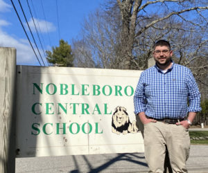 Ira Michaud stands outside Nobleboro Central School on Tuesday, April 13. Michaud, currently principal of Edgecomb Eddy School, will start a new position as NCS principal July 1. (Photo courtesy Ira Michaud)