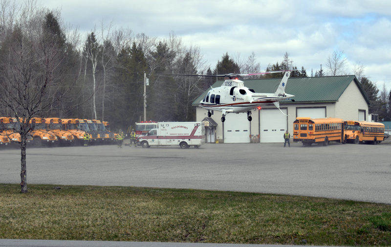 A LifeFlight helicopter lands in the parking lot of the RSU 40 bus garage in Waldoboro on Sunday, April 18. Deborah Leavitt, of Union, was LifeFlighted to Central Maine Medical Center in Lewiston after a crash on Route 1. (Evan Houk photo)
