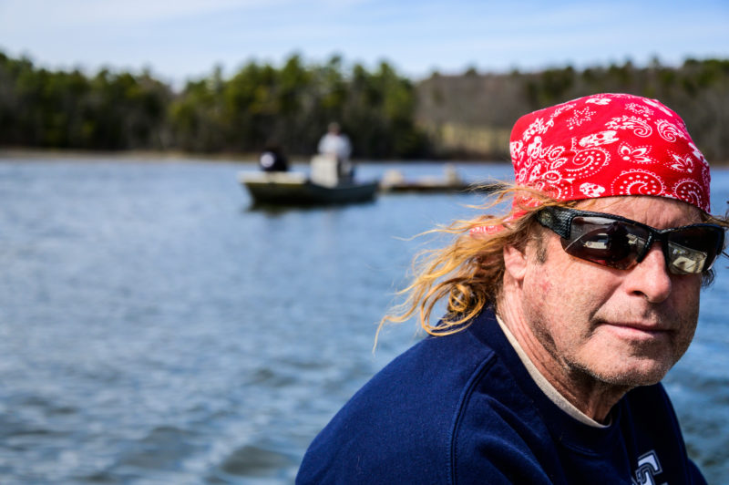 Clammer Glen Melvin leads a boat towing a new clam upweller to its location for spawning season in Waldoboro on Thursday, April 15. (Bisi Cameron Yee photo)