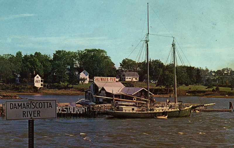 Ed Myers Saltwater Pier and Restaurant with a 1885 two-masted schooner tied alongside it. (Postcard courtesy Calvin Dodge)