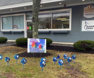 A pinwheel garden planted by Healthy Kids outside of the Cheney Insurance building in Damariscotta.