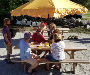 Customers enjoy Sasanoa Brewing's outdoor tasting room. The brewery will open its outdoor tasting room for the season the weekend of May 1.