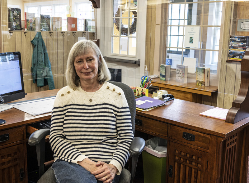 Yvennoe Gloede poses for a picture at her desk at the Bremen Library on Saturday, May 8. Gloede has been the librarian for the last three years. (Bisi Cameron Yee photo)