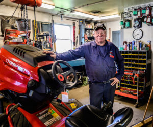 Jay Verney leans against a Troy-Bilt tractor at Phillips Power Products, a division of Colby & Gale, in Damariscotta on Friday, May 14. Verney retired from Colby & Gale on Tuesday, May 18, after exactly 40 years. (Bisi Cameron Yee photo)