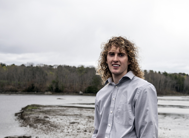 Zak Melvin stands in front of the Medomak River in Waldoboro on Saturday, May 8. Melvin calls the river "his safe place" where he can escape the stress of teaching and return to clamming, which he has done since he was 10. (Bisi Cameron Yee photo)