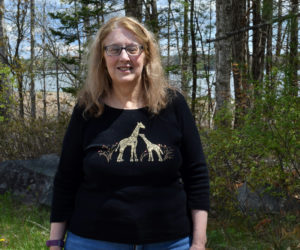 Laurie McBurnie stands in front of Great Salt Bay on Monday, May 10. McBurnie has spent her life working with children and is actively involved in the Nobleboro Cemetery Committee and the Nobleboro Historical Society. (Evan Houk photo)