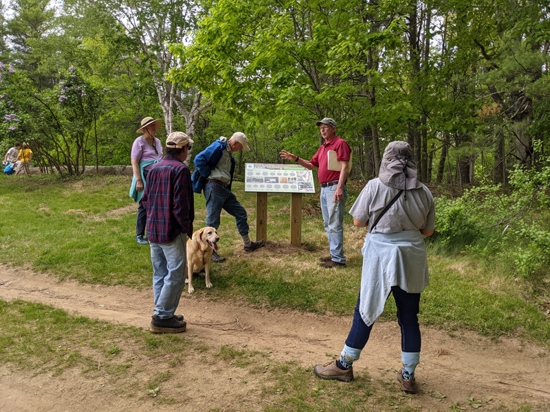 Dennis Dunbar (second from right) leads a tour of Dunton family home sites and the Jeremy's Ramble trail on the Carl and Barbara Segerstrom Preserve at Squam Creek, Westport Island, Sunday, May 23. (Nate Poole photo)